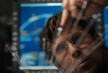 Ryan Gosling as Ryland Grace examining scientific equipment aboard a spacecraft in Project Hail Mary, one of the major popcorn movies coming in spring 2026.